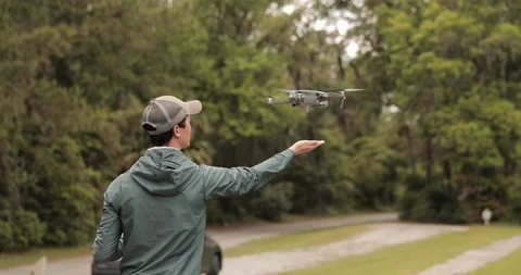 Man catching flying drone by hand Stock Footage 111170145