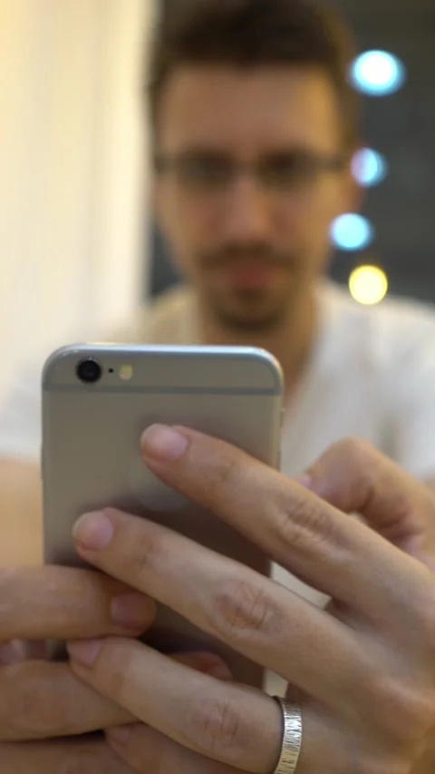 Man caucasian using smartphone in coffeeshop to chat and contact people Stock Footage 320413623