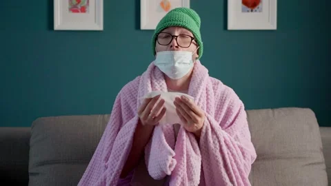 The man caught a cold. the man blows his nose into a handkerchief. a man with a  Stock Footage 160162647