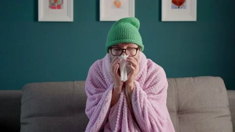 The man caught a cold. the man blows his nose into a handkerchief. a man with a  Stock Footage 160162775