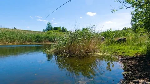 Man caught a pike in the river 스톡 동영상 196801417