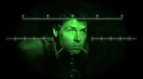 Man caught in the sniper's night vision cross hairs 動画素材 56646156