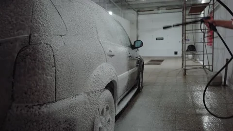 Man causes the foam on the car Video stock 139565024