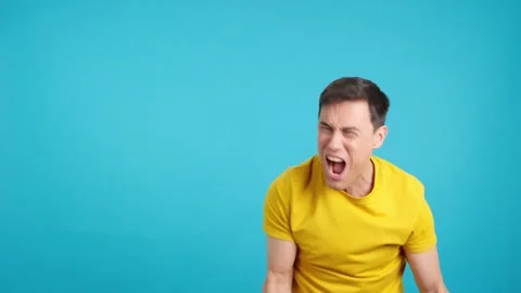 Man celebrating while pointing to the side Stock Footage 248126511