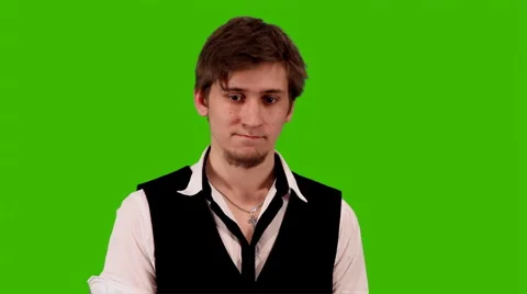 Man with a Cell Phone on a Green Background Stock Footage