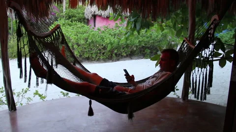 Man on Cell Phone in Hammock Stock Footage 46039121