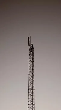 Man on Cell Tower Stock Photos