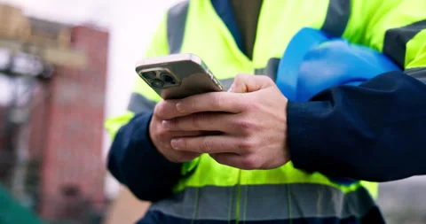 Man, cellphone and hands of construction worker on site with texting, Vídeos de archivo 337036561