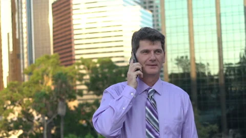 Man on cellphone downtown slowmo Stock Footage 201502001