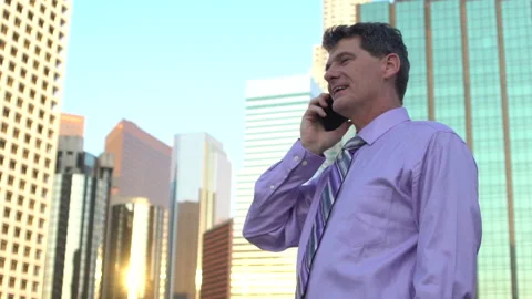 Man on cellphone in downtown talks Stock Footage 201502000
