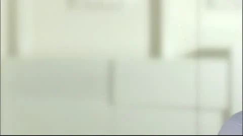 A man with a cellphone in an office Stock Footage 11298037