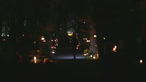 Man on the cemetery at night Video stock 235466728