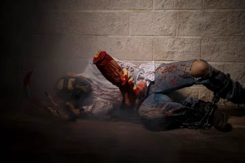 Man chained with blood and knife, has a severed leg blood Stock Photos