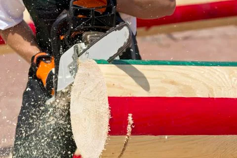 Man with chainsaw cutting Stock Photos