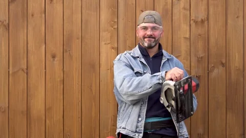 A man with a chainsaw in his hands 4K Stock-Footage 291263620