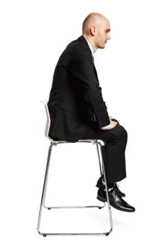 Man on chair Stock Photos