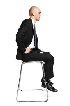 Man on chair Stock Photos