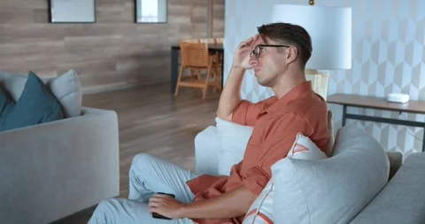 Man chair puts down phone, lost thought, modern contemplation. reflection fast Stock Footage 270664420