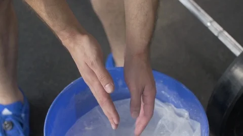 Man chalking hands before workout. slow motion Stock Footage 114030482