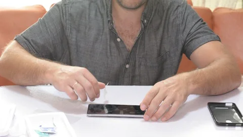 Man changes the cracked safety glass. Stock-Footage 95424495