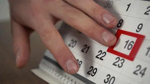 Man changes the date on the calendar to the next day Stock Footage 145926481