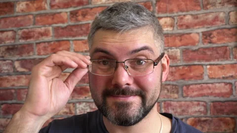 The man changes his glasses. Close-up 4K Video stock 150287272