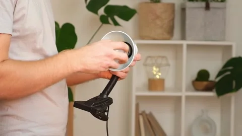 The man changes lamp. Energy-saving lamp. Replacement of an energy-saving lamp. Stock Footage 218613722