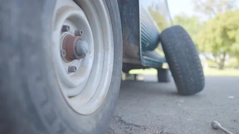 Man Changes Tire - Slow Motion Stock Footage 178313162