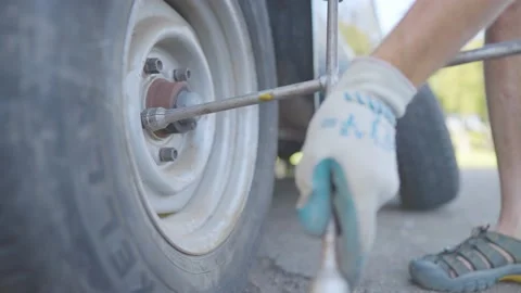 Man Changes Tire - Slow Motion Stock Footage 178318414