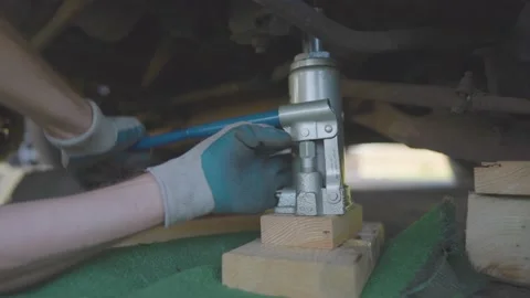 Man Changes Tire - Slow Motion Stock Footage 178485986