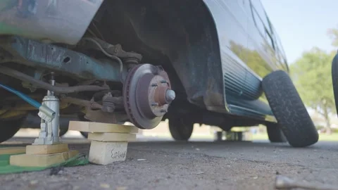 Man Changes Tire - Slow Motion Stock Footage 178493741