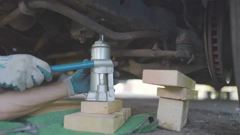 Man Changes Tire - Slow Motion Stock Footage 178493877