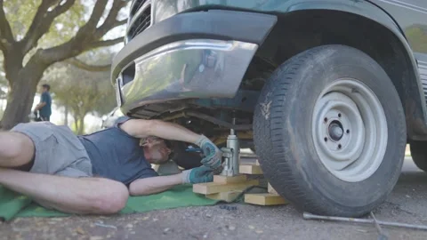 Man Changes Tire - Slow Motion Stock Footage 178504770