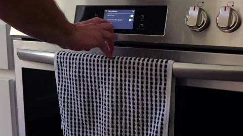 Man Changing Appliance Clock for Daylight Savings Stock Footage 340532621