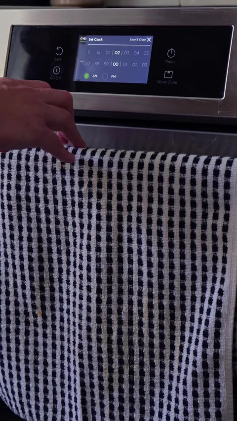 Man Changing Appliance Clock for Daylight Savings Stock Footage 340532627