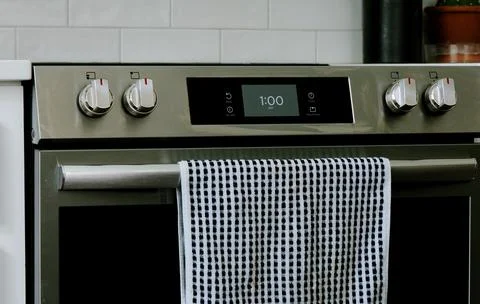 Man Changing Appliance Clock for Daylight Savings Stock Photos