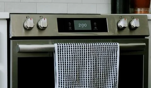 Man Changing Appliance Clock for Daylight Savings Stock Photos