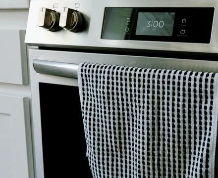 Man Changing Appliance Clock for Daylight Savings Stock Photos