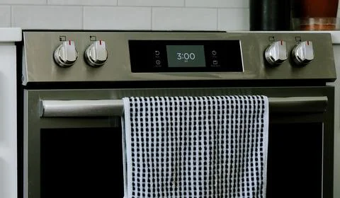 Man Changing Appliance Clock for Daylight Savings Stock Photos