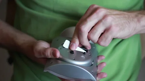 Man changing battery in a clock 動画素材 64621496