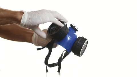 Man changing a filter on a half face mask or respirator white background. HD Stock-Footage 129175132