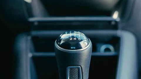 A man changing gear in a car Stock Footage 101815337