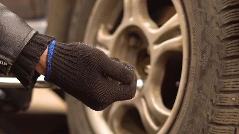 Man changing wheel on a car Stock Footage 88980560