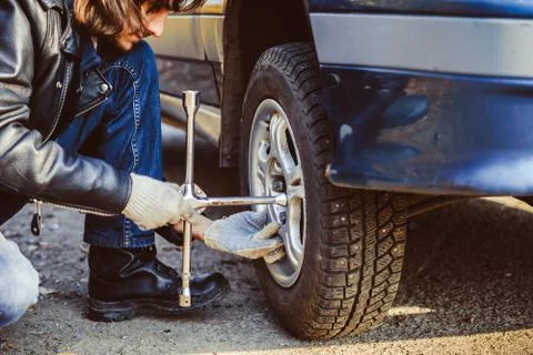 Man changing wheel on a car Stock Photos