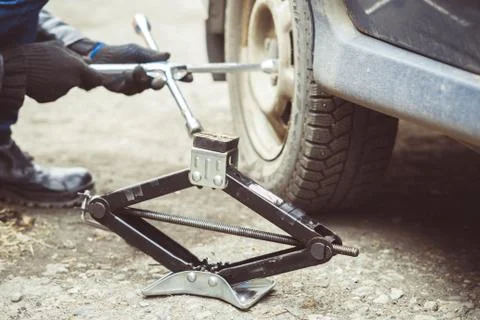 Man changing wheel on a car Stock Photos