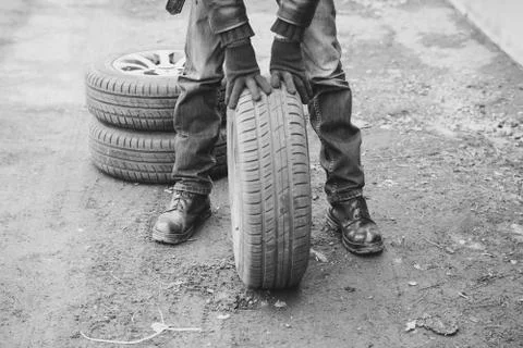 Man changing wheel on a car Stock Photos