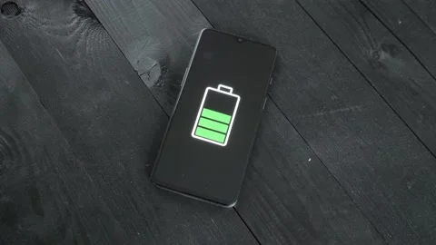 Man charge smartphone using wireless charging table. Stock Footage 201684909