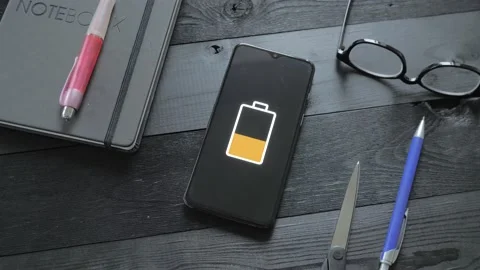 Man charge smartphone using wireless charging table. Stock Footage 201747560