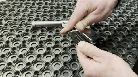 Man Charging His Handgun with Bullets Video stock 224347157