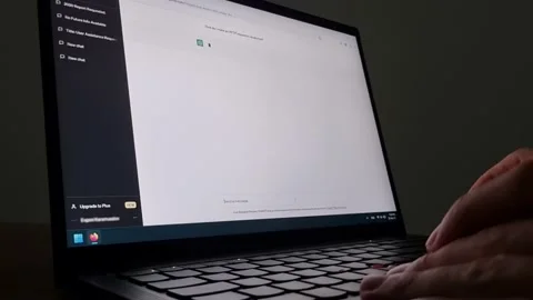 Man is chatting with the artificial intelligence chatbot ChatGPT in a dark Stock Footage 239610016